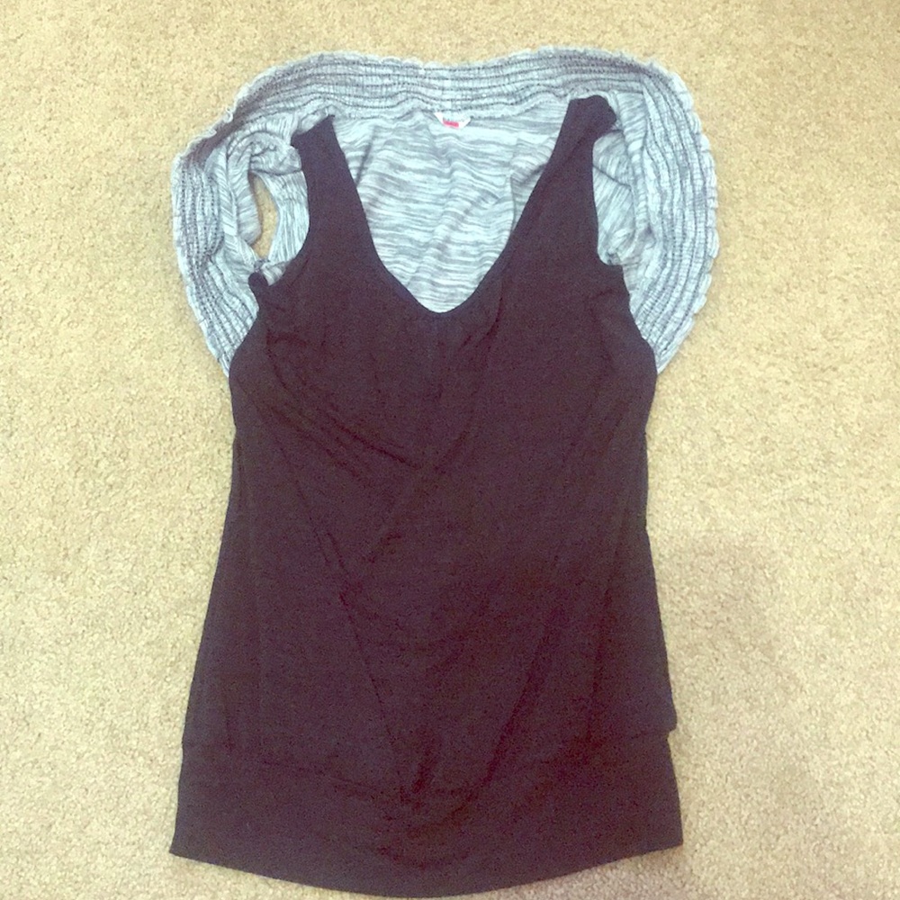 Grey short jacket attached to black tank top